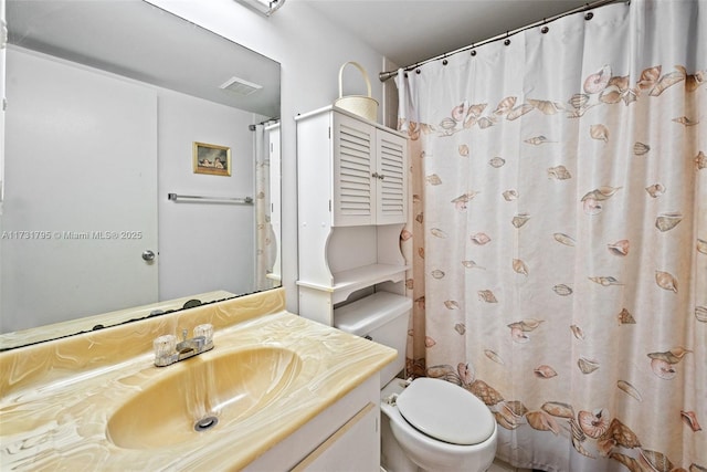 bathroom with vanity, toilet, and walk in shower