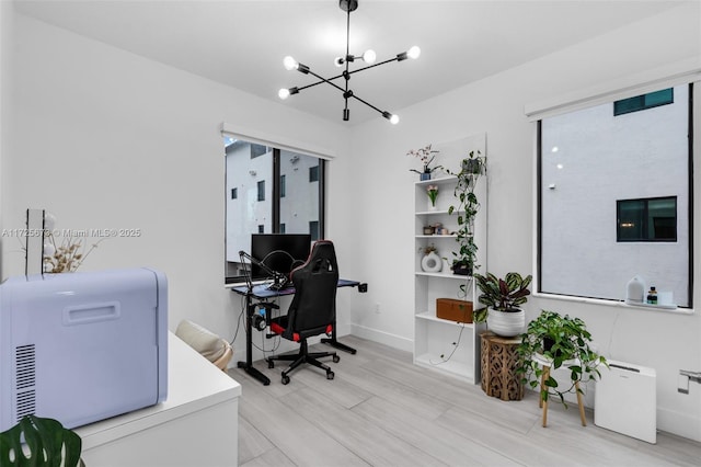 office featuring a notable chandelier