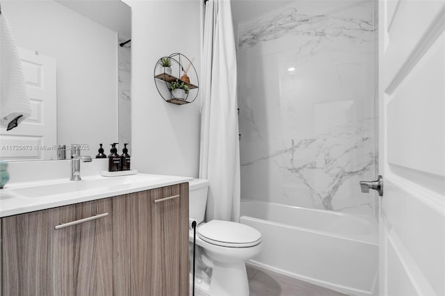 full bathroom featuring vanity, shower / bath combination with curtain, and toilet