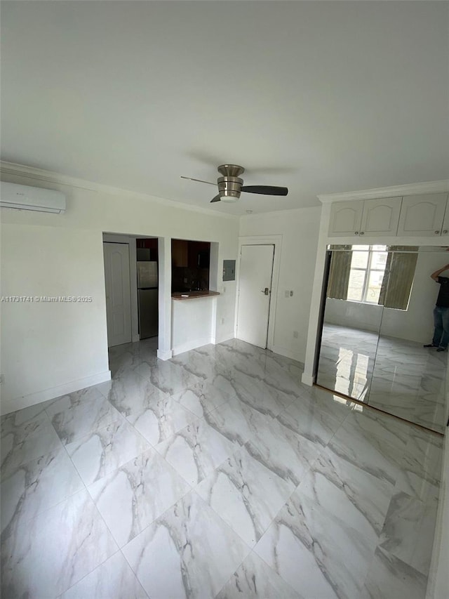 interior space featuring stainless steel refrigerator, ceiling fan, electric panel, and a wall mounted AC