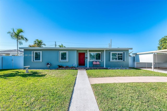 single story home with a carport and a front lawn