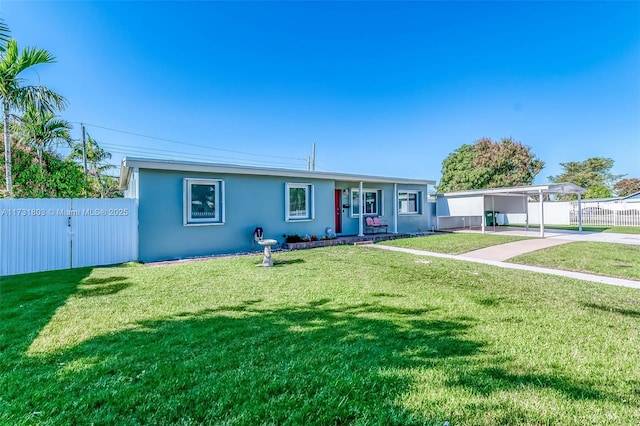 single story home with a front lawn and a carport