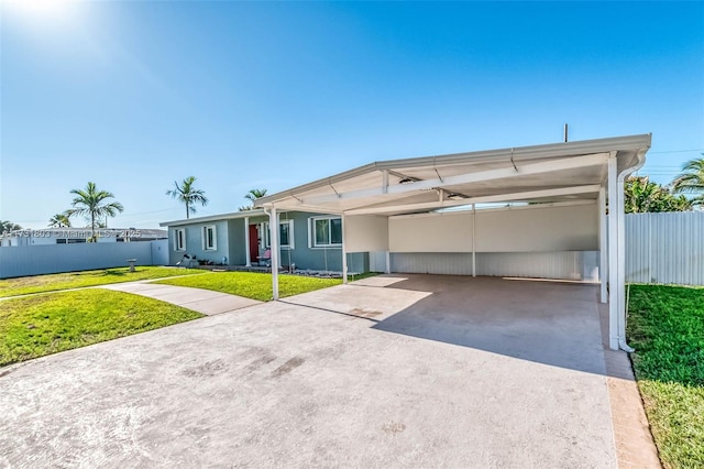 ranch-style house with a front lawn and a carport