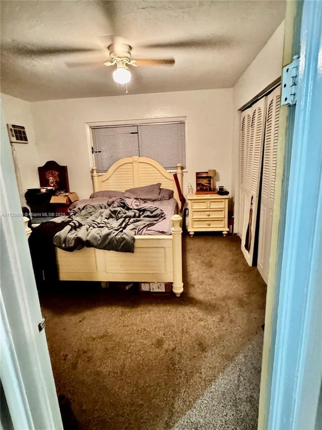 bedroom with ceiling fan and a closet