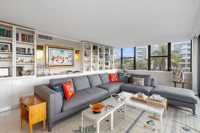 tiled living room featuring ornamental molding