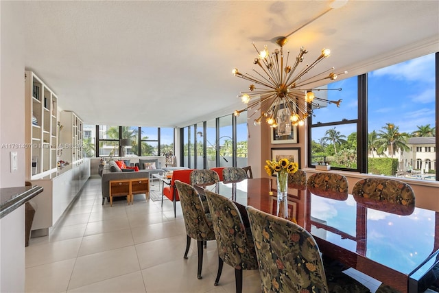 dining room featuring a notable chandelier and light tile patterned flooring