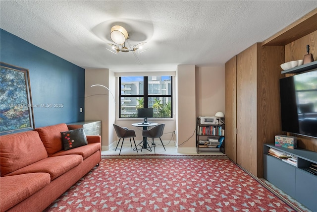 carpeted living room with a textured ceiling and wooden walls