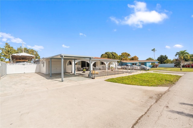 exterior space with a carport and a garage