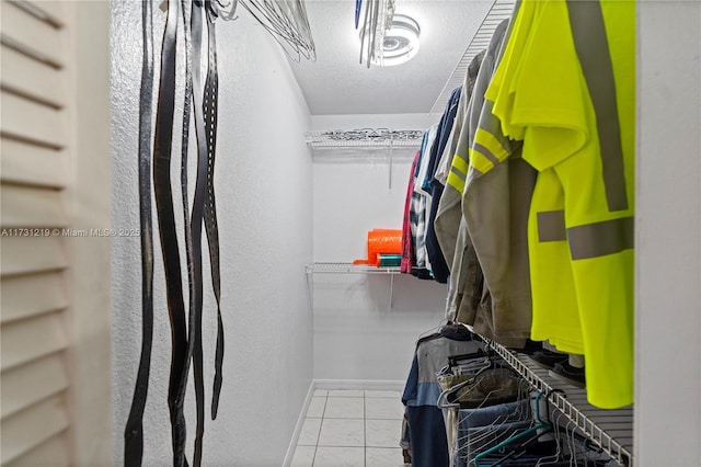 walk in closet featuring light tile patterned floors