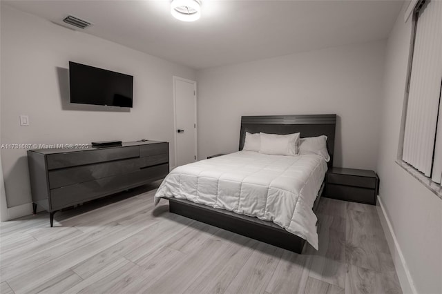 bedroom with light hardwood / wood-style floors