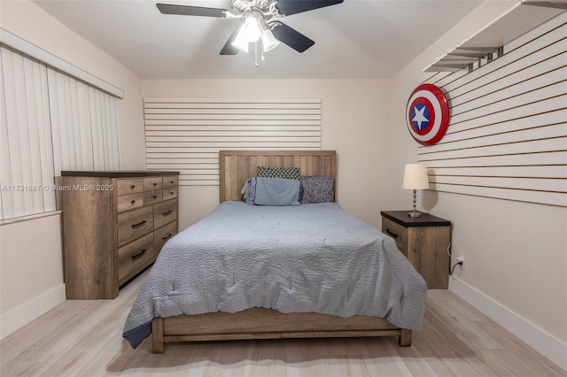 bedroom with ceiling fan and light wood-type flooring