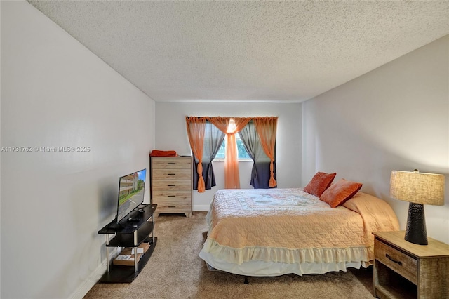 carpeted bedroom featuring a textured ceiling