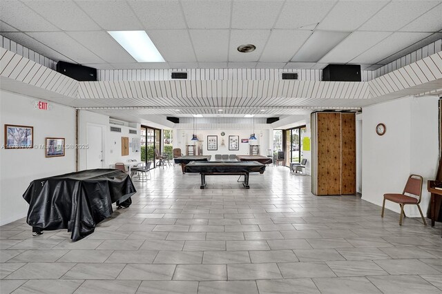 playroom featuring pool table, a healthy amount of sunlight, and a drop ceiling