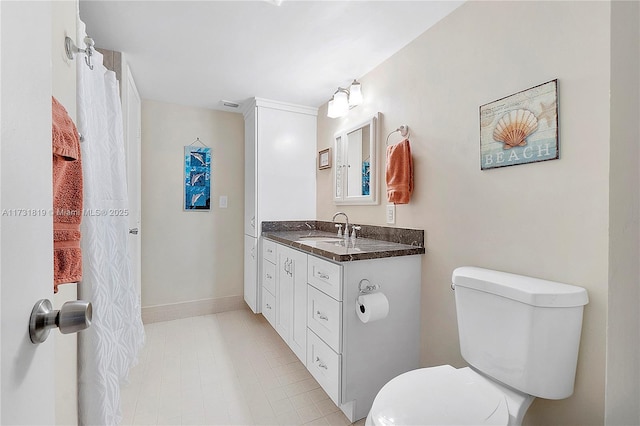 bathroom with vanity and toilet