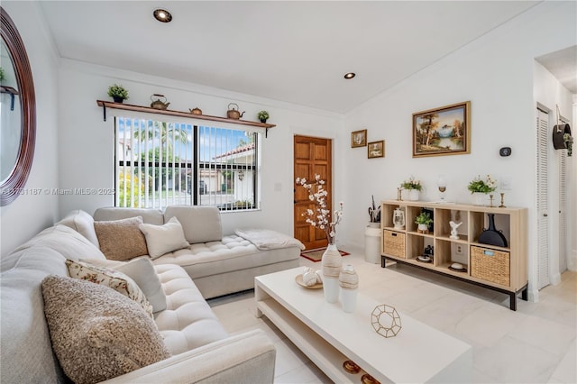 living room with vaulted ceiling and crown molding