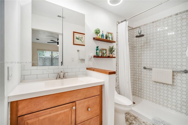 bathroom featuring toilet, vanity, curtained shower, ceiling fan, and decorative backsplash