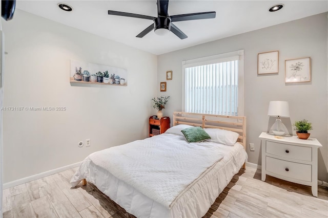 bedroom with ceiling fan and light hardwood / wood-style floors