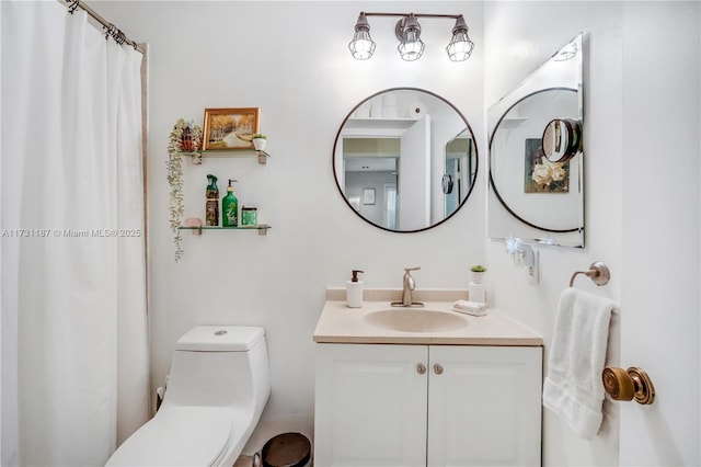 bathroom featuring vanity and toilet