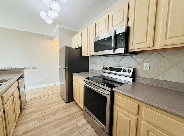 kitchen with light brown cabinetry, tasteful backsplash, light wood-type flooring, ornamental molding, and appliances with stainless steel finishes