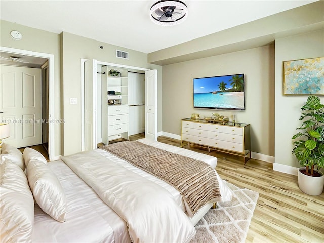 bedroom featuring light hardwood / wood-style floors and a closet