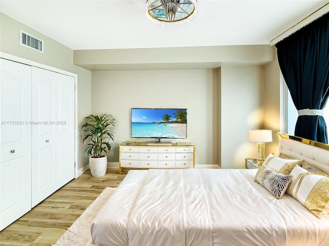 bedroom featuring a closet and light hardwood / wood-style flooring