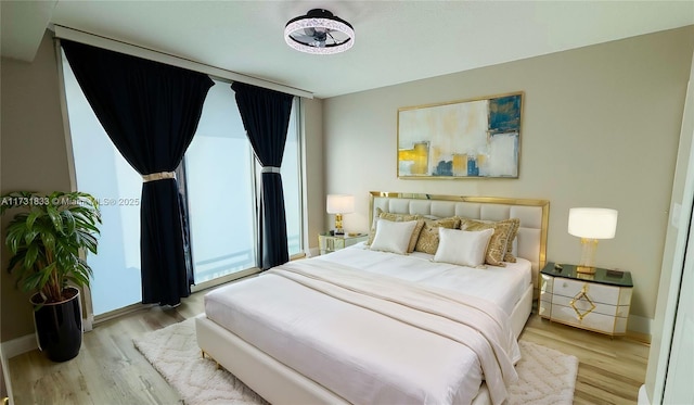 bedroom with light wood-type flooring