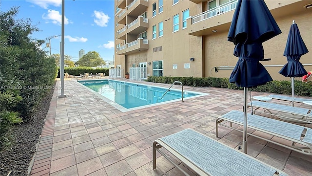 view of pool featuring a patio