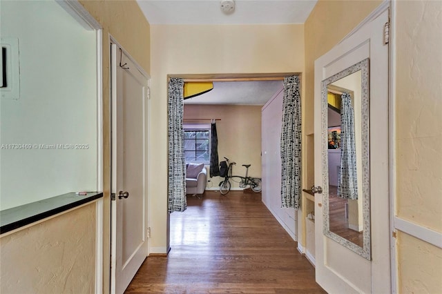 hall with dark hardwood / wood-style flooring and french doors