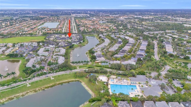 birds eye view of property featuring a water view