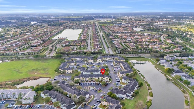 aerial view featuring a water view and a residential view