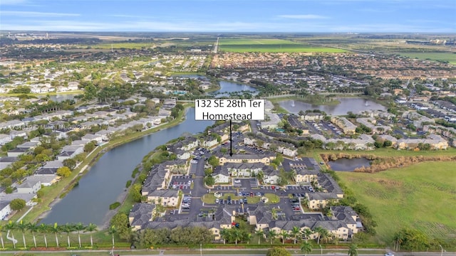 bird's eye view with a residential view and a water view