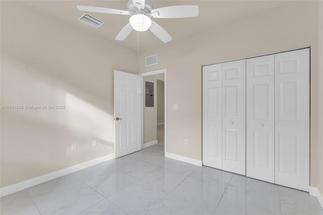 unfurnished bedroom with marble finish floor, baseboards, electric panel, and visible vents