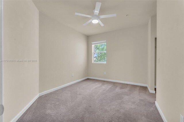 unfurnished room with light carpet, ceiling fan, and baseboards