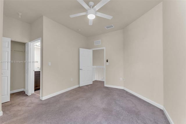 unfurnished bedroom with light colored carpet, visible vents, and baseboards