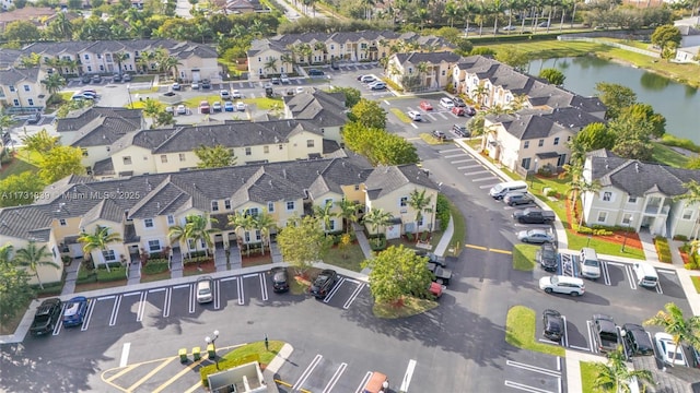 bird's eye view featuring a water view and a residential view