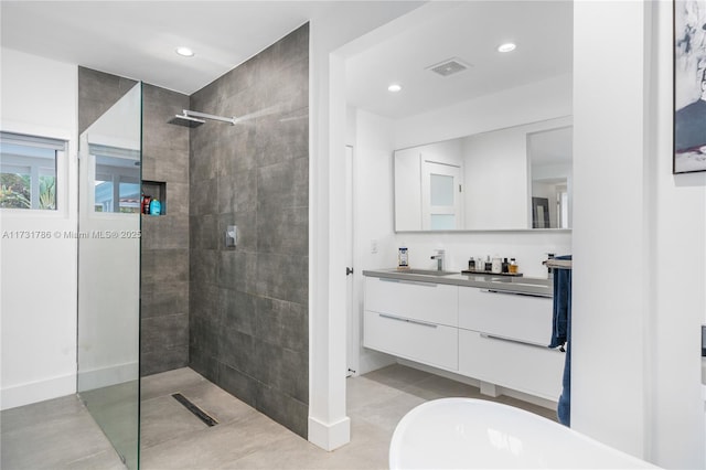 bathroom featuring vanity and separate shower and tub