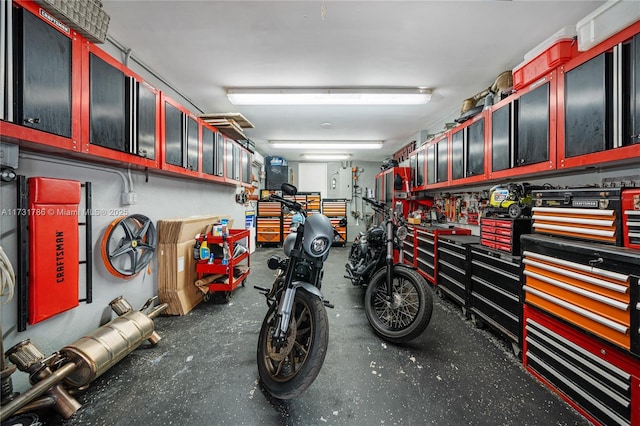 garage with a workshop area