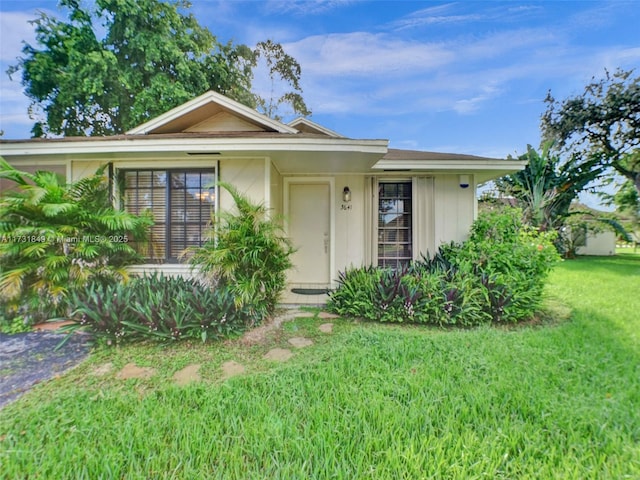 ranch-style house with a front yard