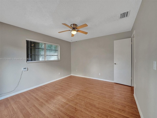 unfurnished room featuring ceiling fan, a textured ceiling, and light hardwood / wood-style floors