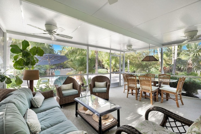 sunroom with ceiling fan and a wealth of natural light