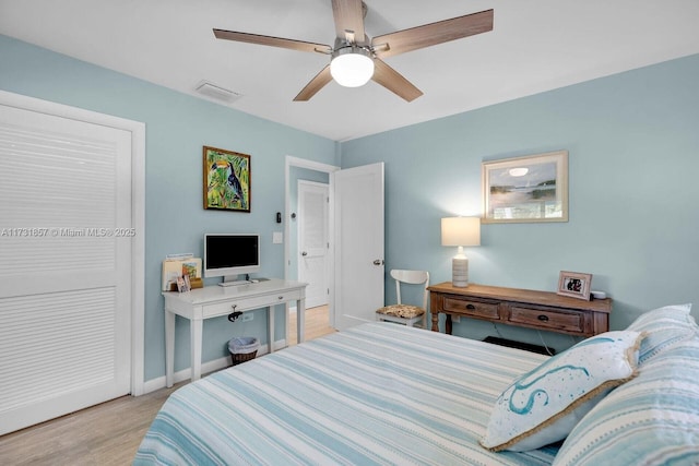 bedroom featuring ceiling fan and light hardwood / wood-style flooring