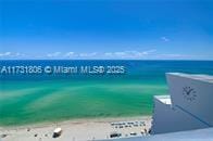 property view of water featuring a beach view