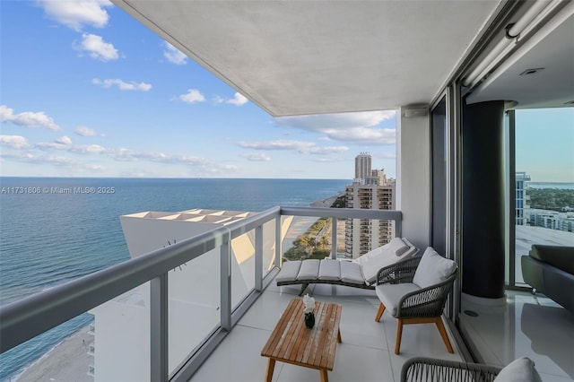 balcony featuring a water view