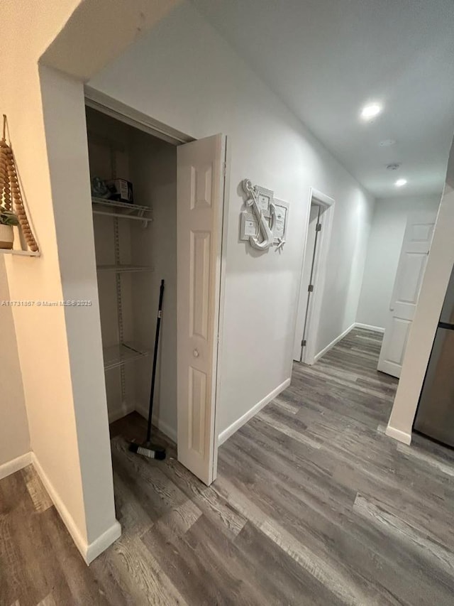 corridor featuring dark hardwood / wood-style floors