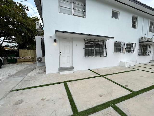 entrance to property with a patio area