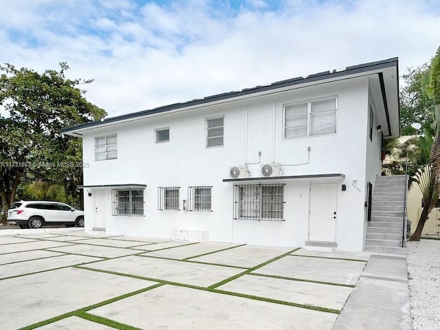 rear view of property featuring a patio area