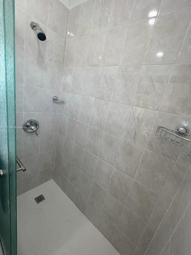 bathroom with tiled shower