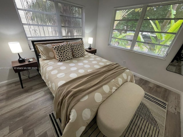 bedroom with hardwood / wood-style flooring