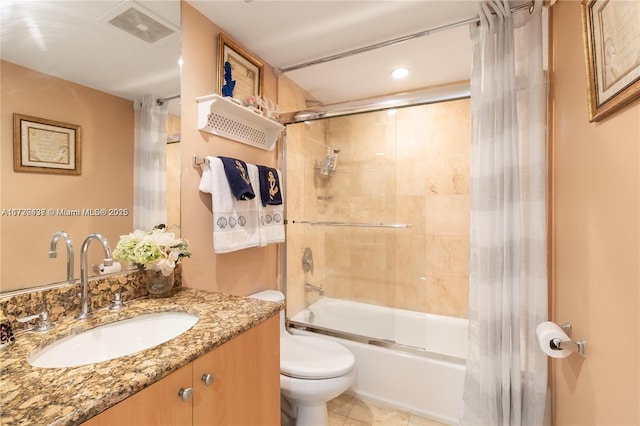 full bathroom featuring vanity, tile patterned flooring, toilet, and combined bath / shower with glass door