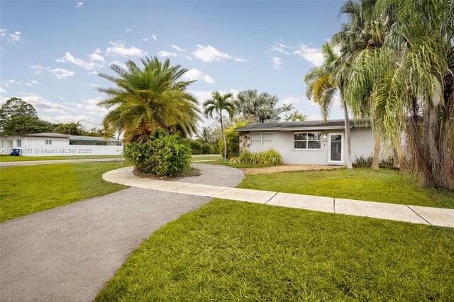 view of front of home with a front lawn